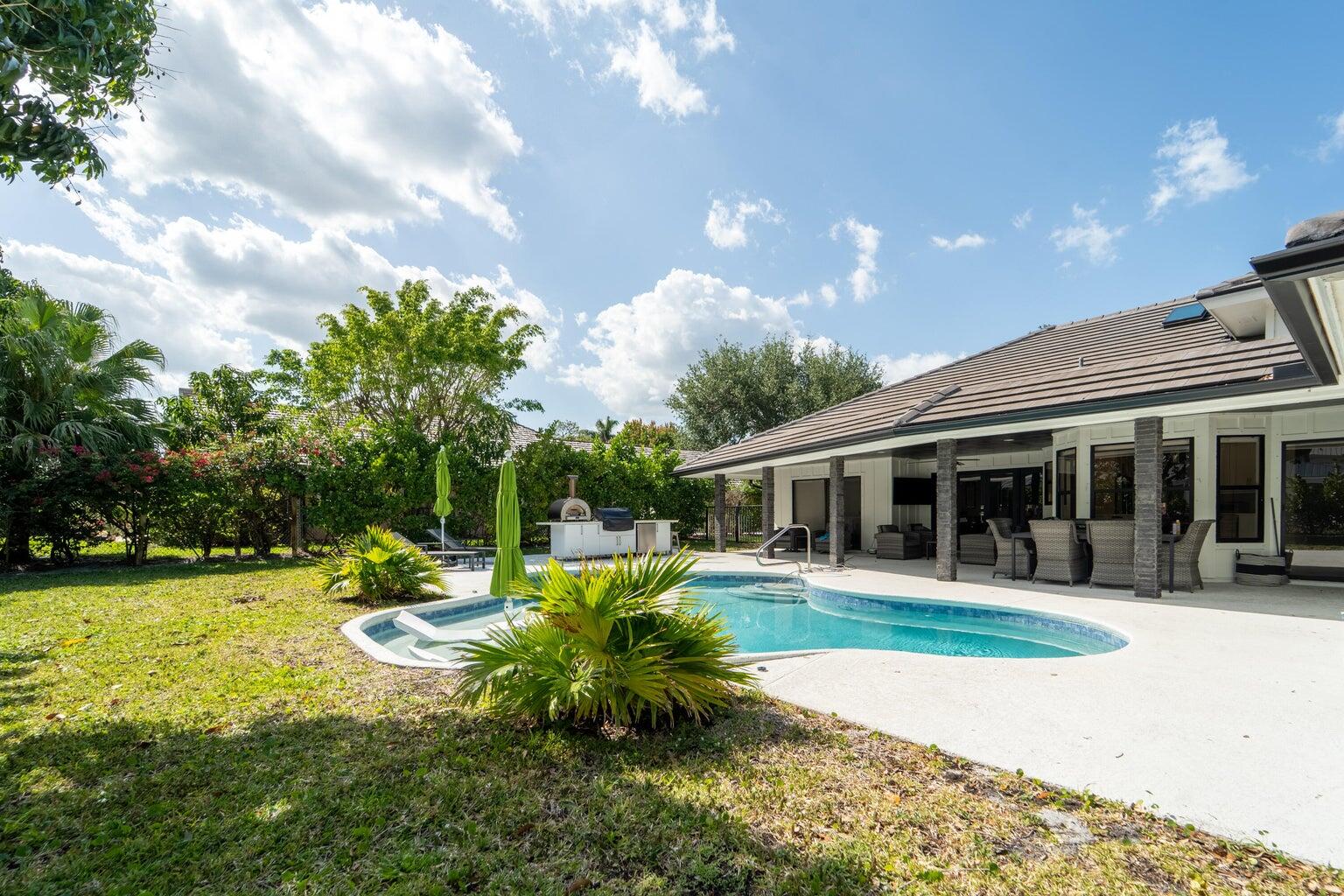 18721 Southeast River Ridge Road Jupiter, FL 33469 - Photo 48 of 74 river ridge pool area with kitchen 3
