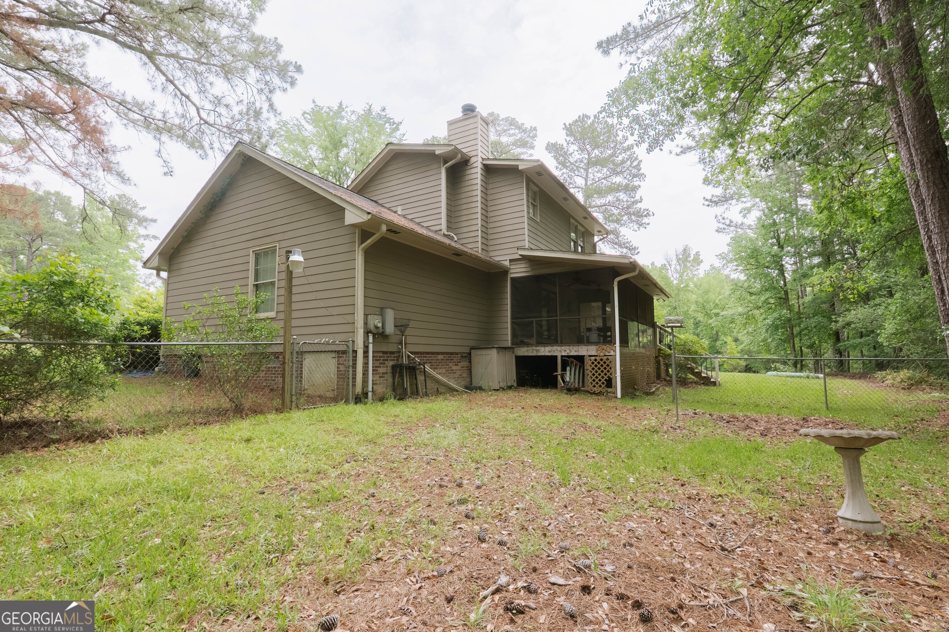 139 Cords Bridge Road Northeast Milledgeville, GA 31061 - Photo 29 of 35 a view of a house with a yard and large tree