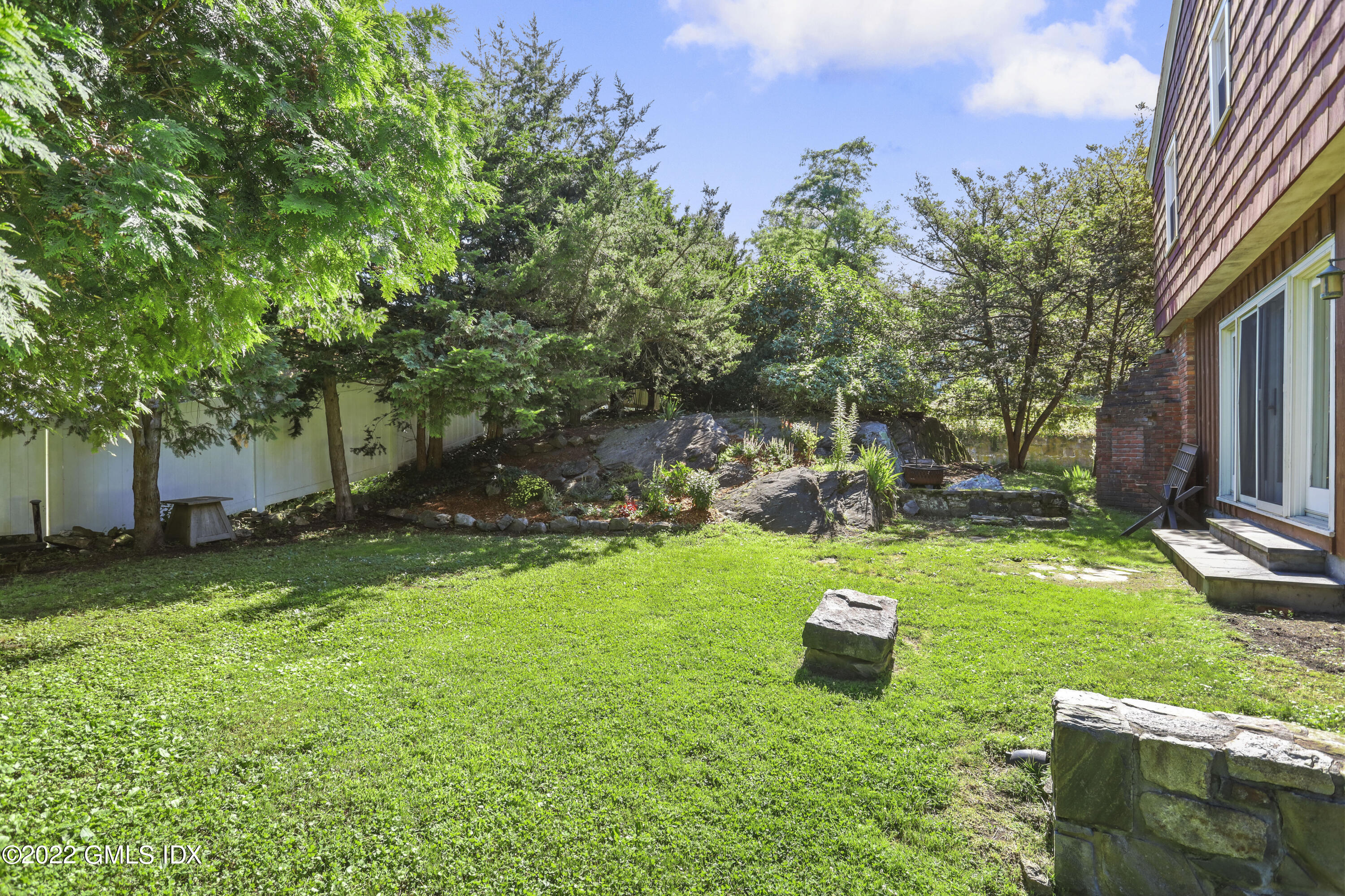 261 Pemberwick Road Greenwich, CT 06831 - Photo 11 of 13 a garden view with a seating space