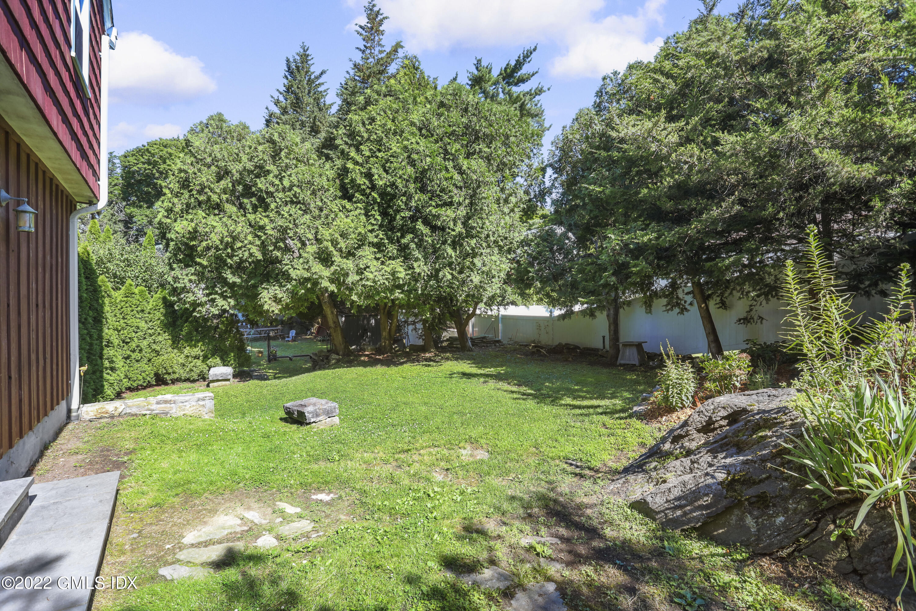 261 Pemberwick Road Greenwich, CT 06831 - Photo 12 of 13 a view of green field with sitting area