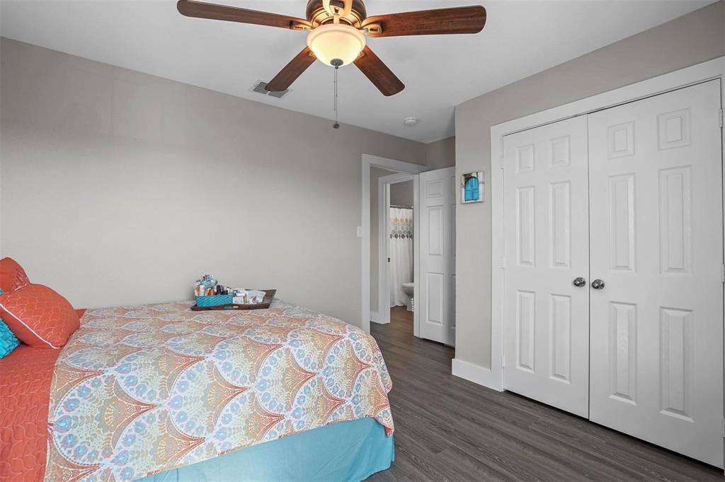 5113 Mountain Spring Trail Fort Worth, TX 76123 - Photo 23 of 35 Bedroom with ceiling fan, dark wood-style flooring, and a closet