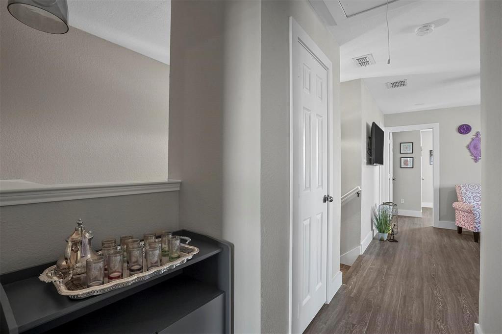 5113 Mountain Spring Trail Fort Worth, TX 76123 - Photo 24 of 35 Corridor with attic access and dark wood-type flooring