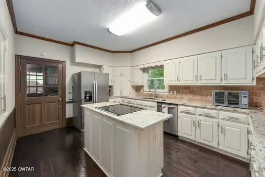 a kitchen with a sink stove and refrigerator