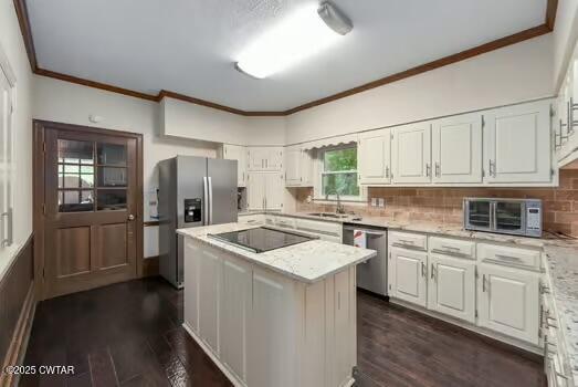 562 Old Jackson Road Henderson, TN 38340 - Photo 13 of 42 a kitchen with a sink stove and refrigerator