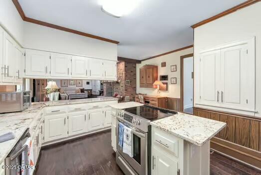 562 Old Jackson Road Henderson, TN 38340 - Photo 14 of 42 a kitchen with stainless steel appliances granite countertop a stove and a sink