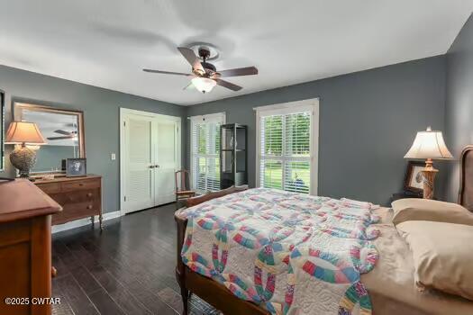 562 Old Jackson Road Henderson, TN 38340 - Photo 16 of 42 a bedroom with a bed and a chandelier