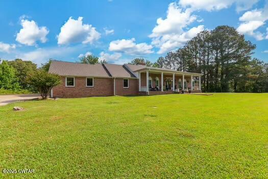 562 Old Jackson Road Henderson, TN 38340 - Photo 2 of 42 a view of house with a garden
