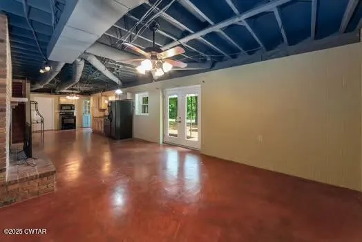 a kitchen with stainless steel appliances granite countertop a refrigerator and a stove