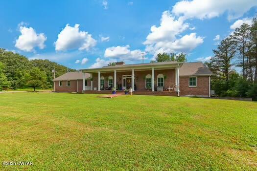 562 Old Jackson Road Henderson, TN 38340 - Photo 3 of 42 a view of a house with a backyard