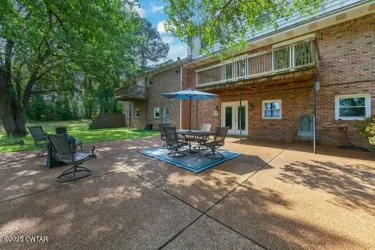 a balcony with wooden floor and fence
