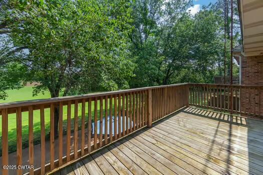 562 Old Jackson Road Henderson, TN 38340 - Photo 41 of 42 a balcony with wooden floor and fence