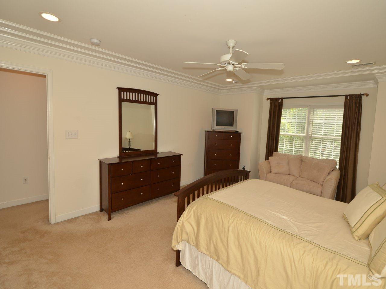 5308 Goldenglow Way Raleigh, NC 27606 - Photo 13 of 25 a bedroom with a bed and a window