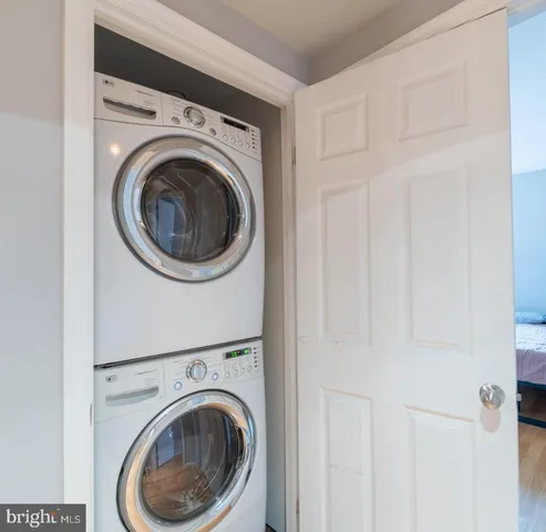 a view of a hallway with washer and dryer