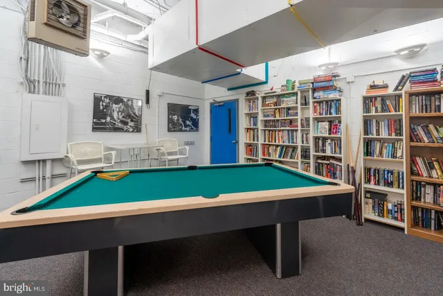 a room with furniture and soccer table