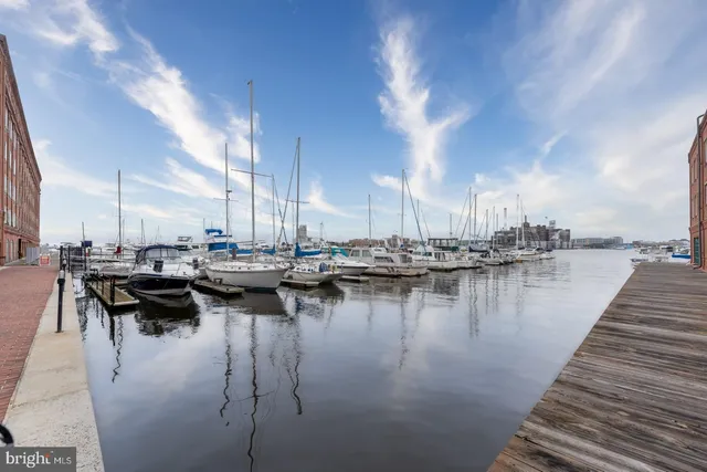 a view of a lake with boats and trees