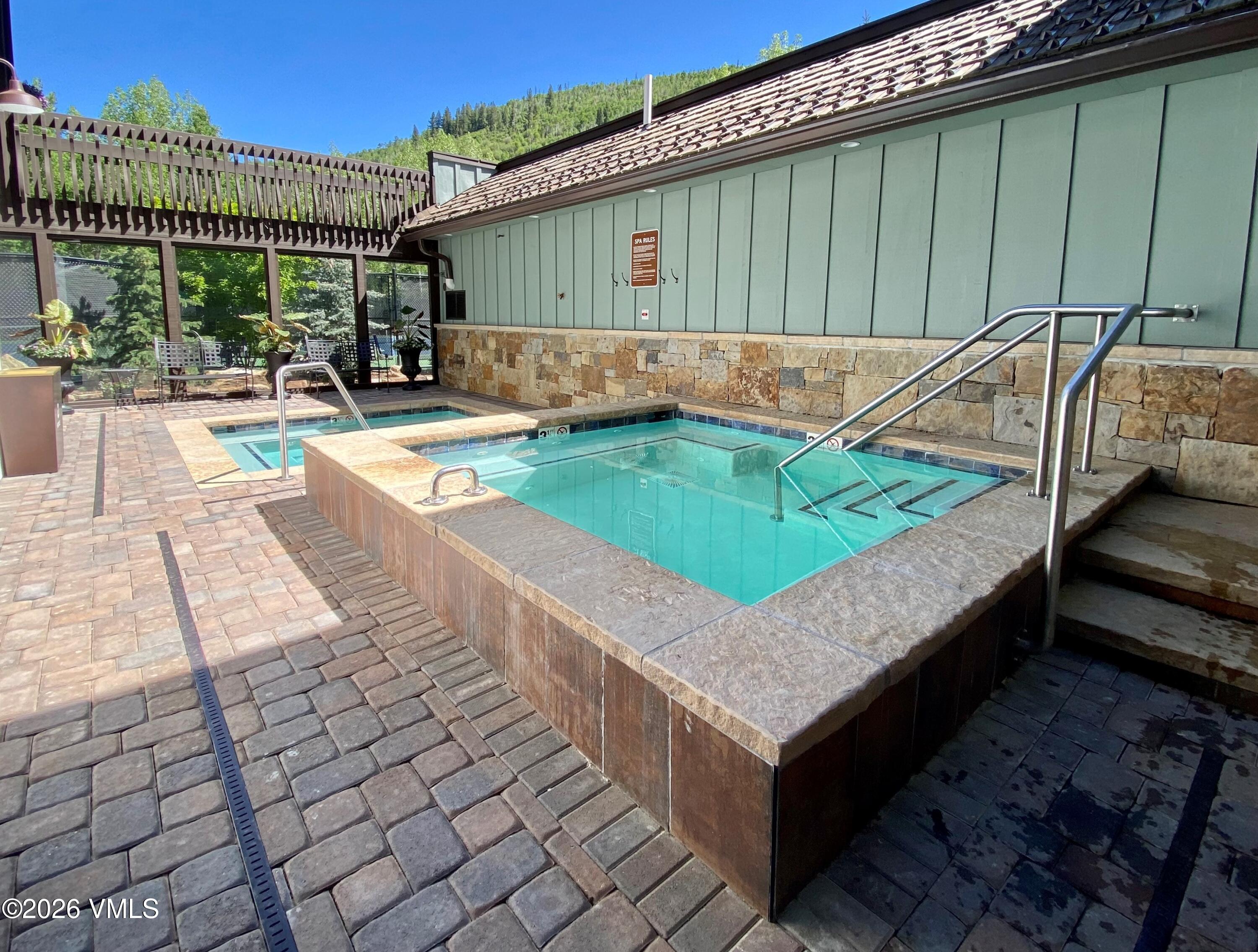 4600 Vail Racquet Club Drive, Unit 610 Vail, CO 81657 - Photo 25 of 26 a view of a backyard with sitting area