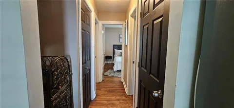 a bed room with a bed and a chair