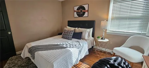 a bathroom with a sink vanity mirror and toilet