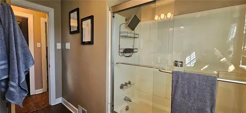 a view of balcony with seating space and wooden floor