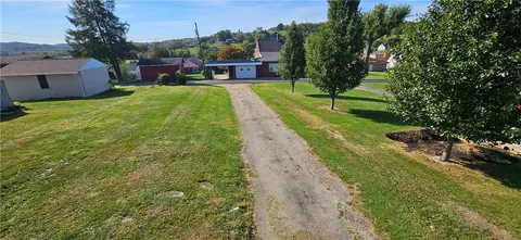 a view of city and trees from a balcony
