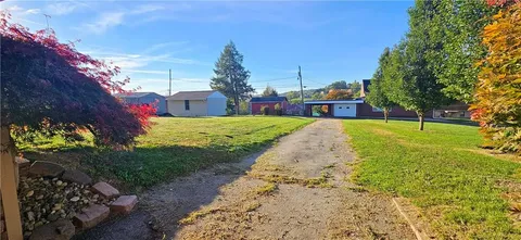 a yellow room with wooden floor and a table