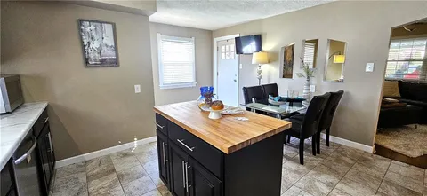 a view of a kitchen area with furniture and window