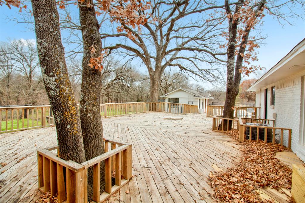 3700 Moseley Road Cross Roads, TX 76227 - Photo 30 of 38 Enjoy this beautiful deck, with several different direct accesses from inside the home.