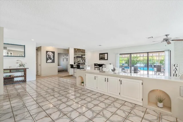 a large white room with cabinets