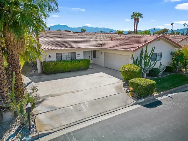 a house with a garden in front of it