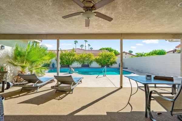 a living room with patio furniture