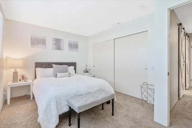 a bedroom with a bed and a cabinets