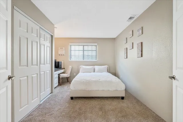 a room with a bed and a window