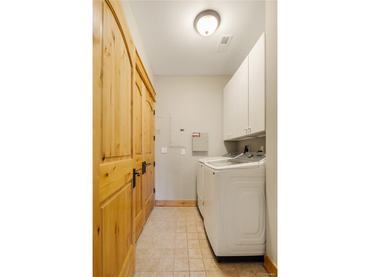 31276 Stone Canyon Road, Unit 201 Evergreen, CO 80439 - Photo 38 of 40 Laundry room located at top of stairs next to coat closet