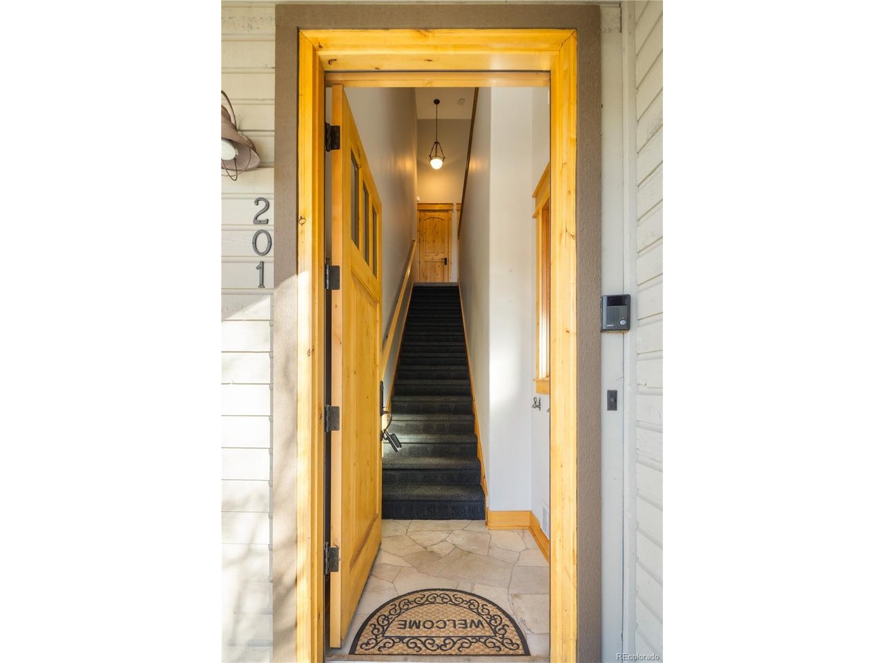 31276 Stone Canyon Road, Unit 201 Evergreen, CO 80439 - Photo 5 of 40 Entryway stairs leading to unit