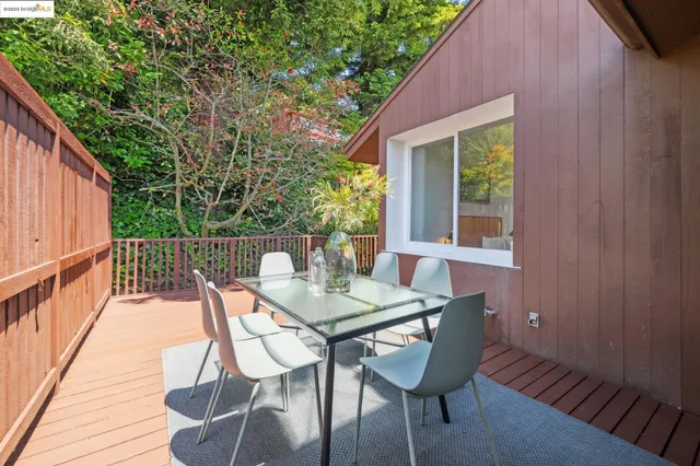 a bedroom with a large bed and a flat tv screen