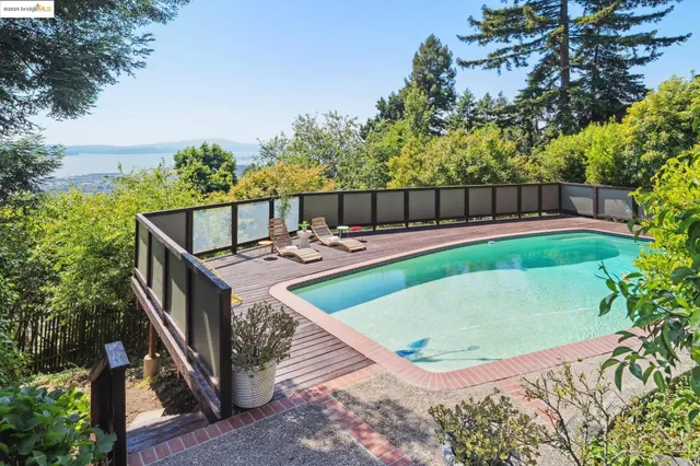 a view of a swimming pool with a patio