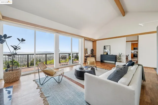 a balcony with table and chairs