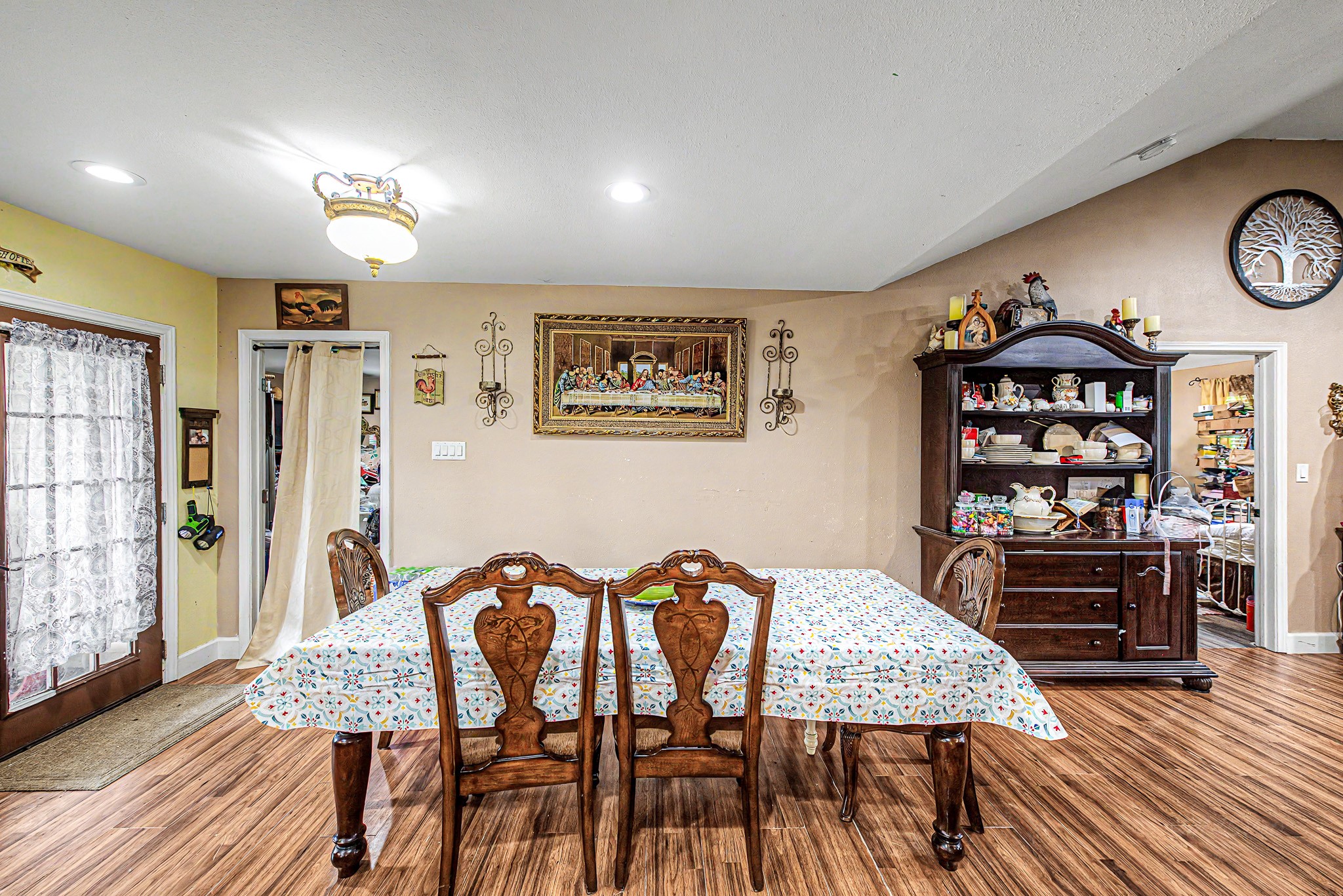 29867 Marti Road Katy, TX 77493 - Photo 16 of 36 a view of a a dining room with furniture window and wooden floor