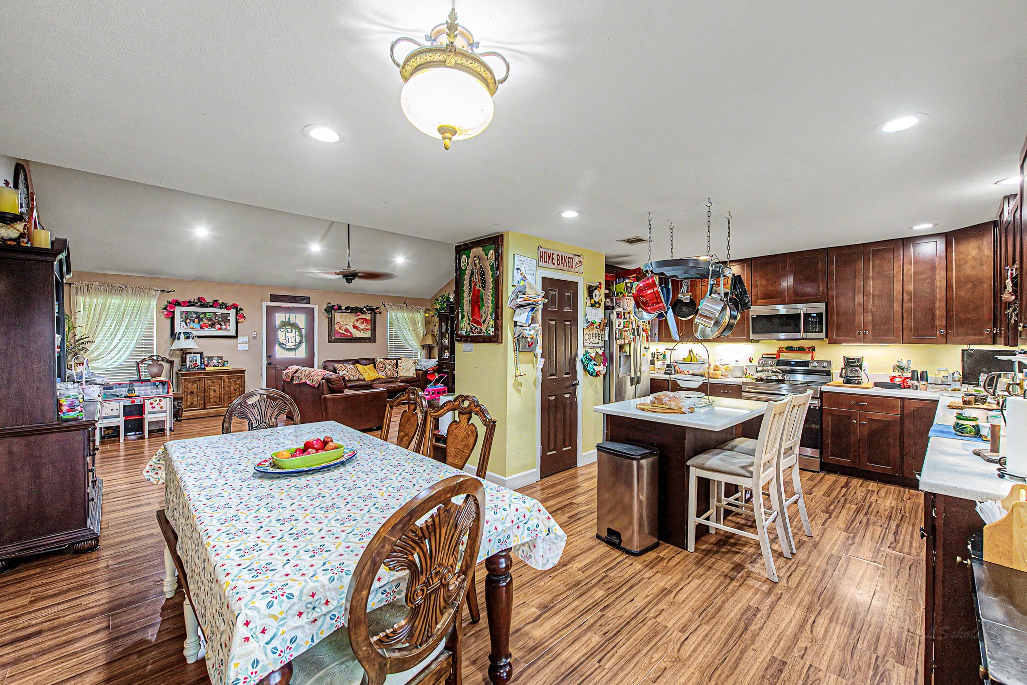 29867 Marti Road Katy, TX 77493 - Photo 17 of 36 a view of a dining room with furniture and wooden floor
