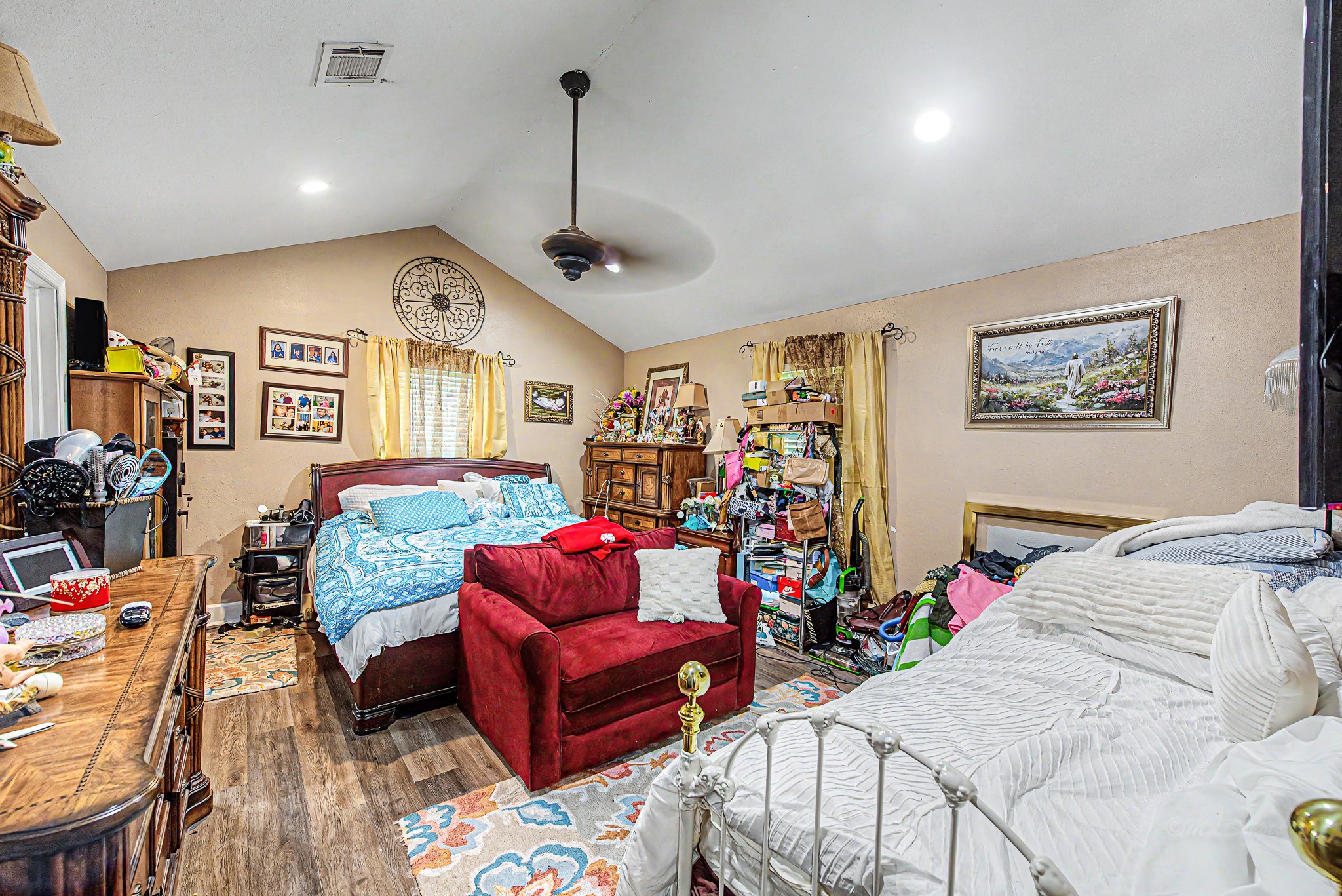 29867 Marti Road Katy, TX 77493 - Photo 21 of 36 a bedroom with furniture and a chandelier