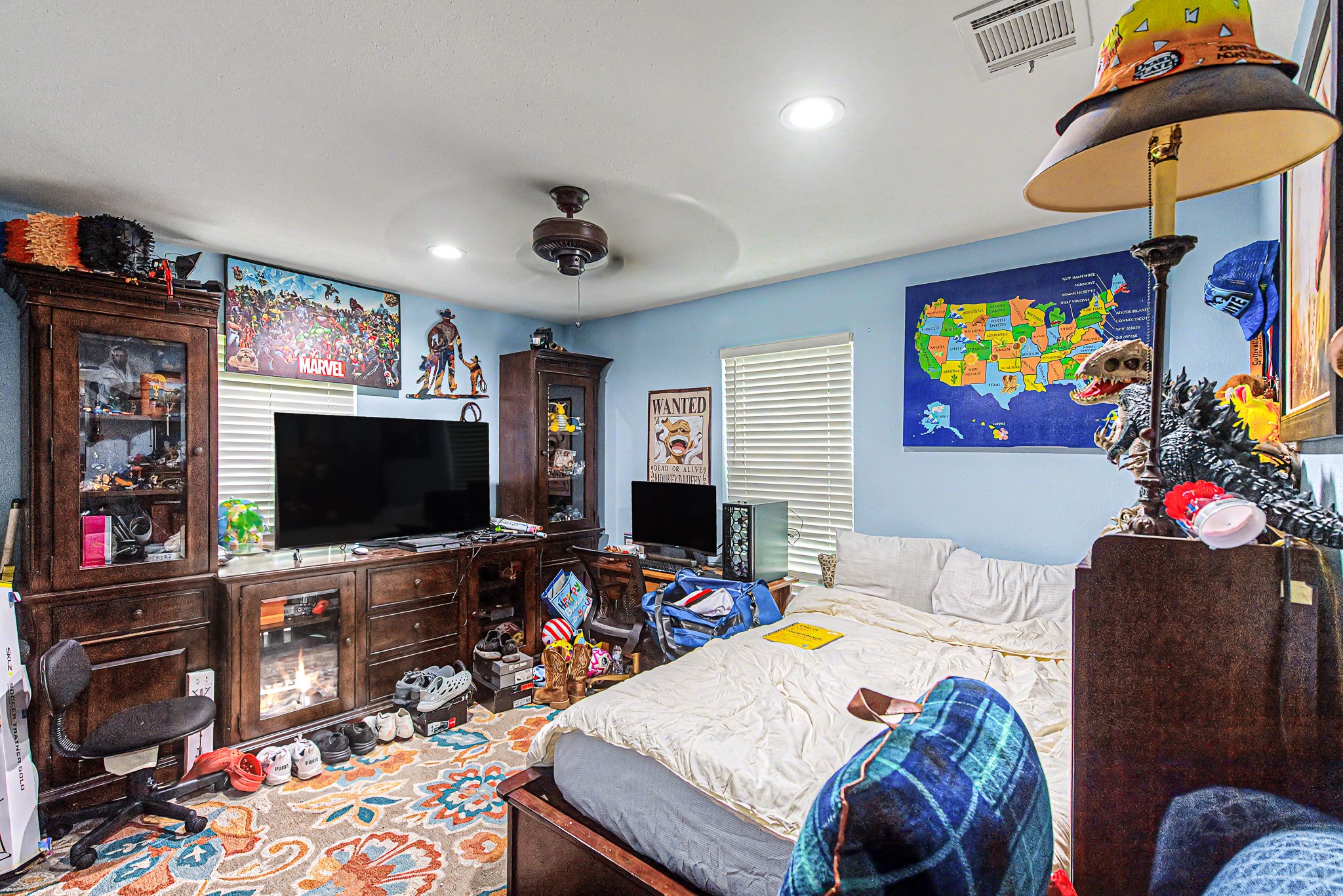 29867 Marti Road Katy, TX 77493 - Photo 23 of 36 a bedroom with a bed and a flat screen tv