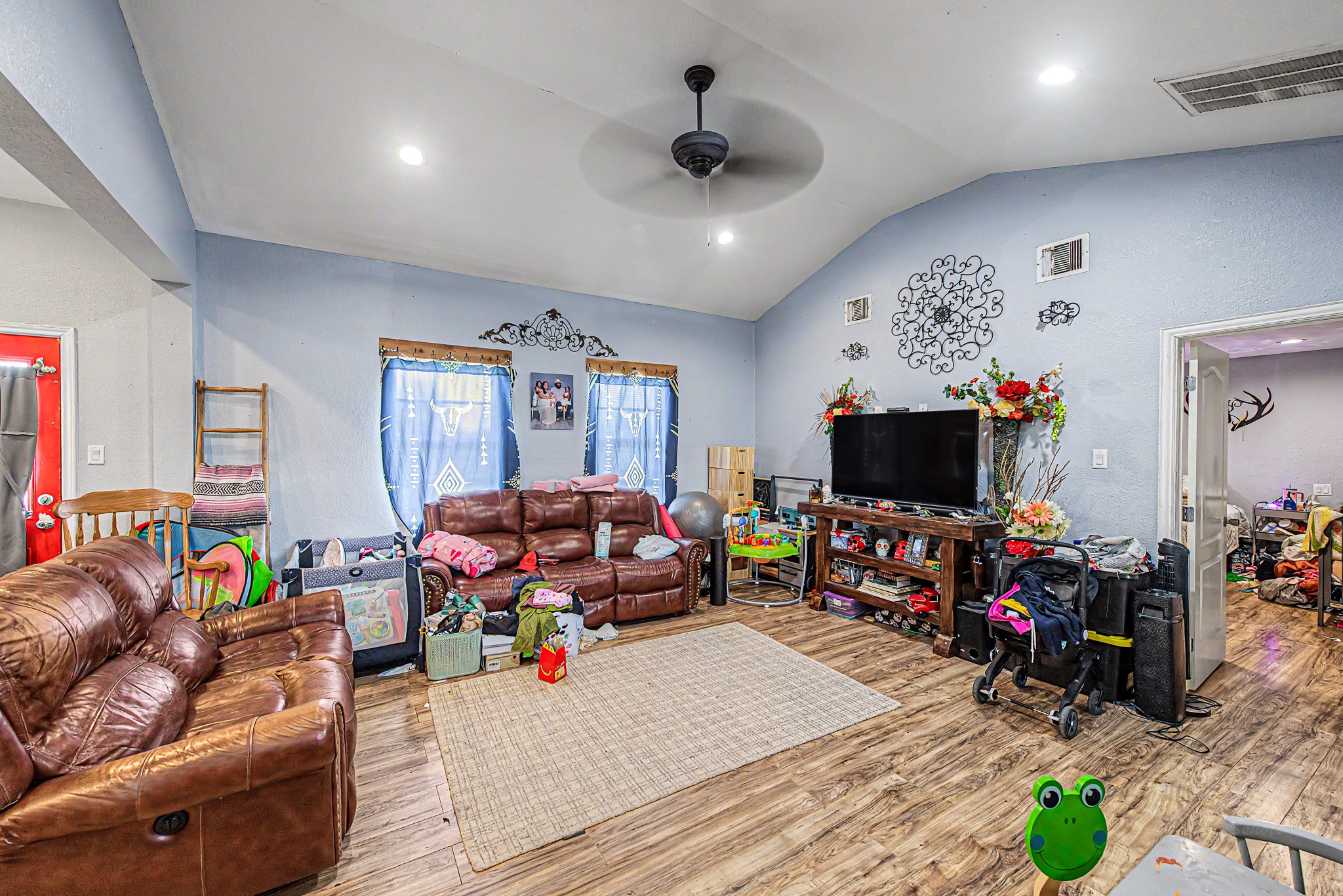 29867 Marti Road Katy, TX 77493 - Photo 27 of 36 a living room with furniture and a flat screen tv
