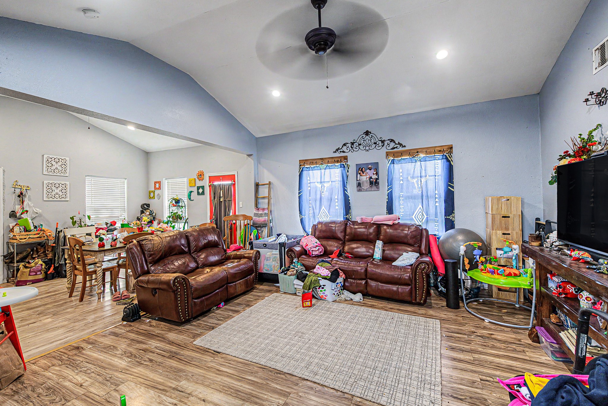 29867 Marti Road Katy, TX 77493 - Photo 28 of 36 a living room with furniture a flat screen tv and a window