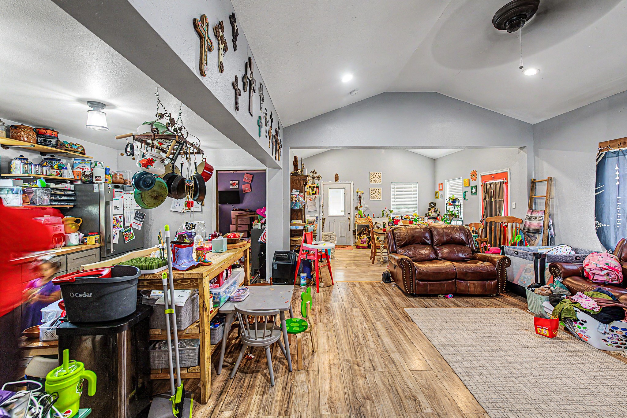 29867 Marti Road Katy, TX 77493 - Photo 29 of 36 a living room filled with furniture and a chandelier