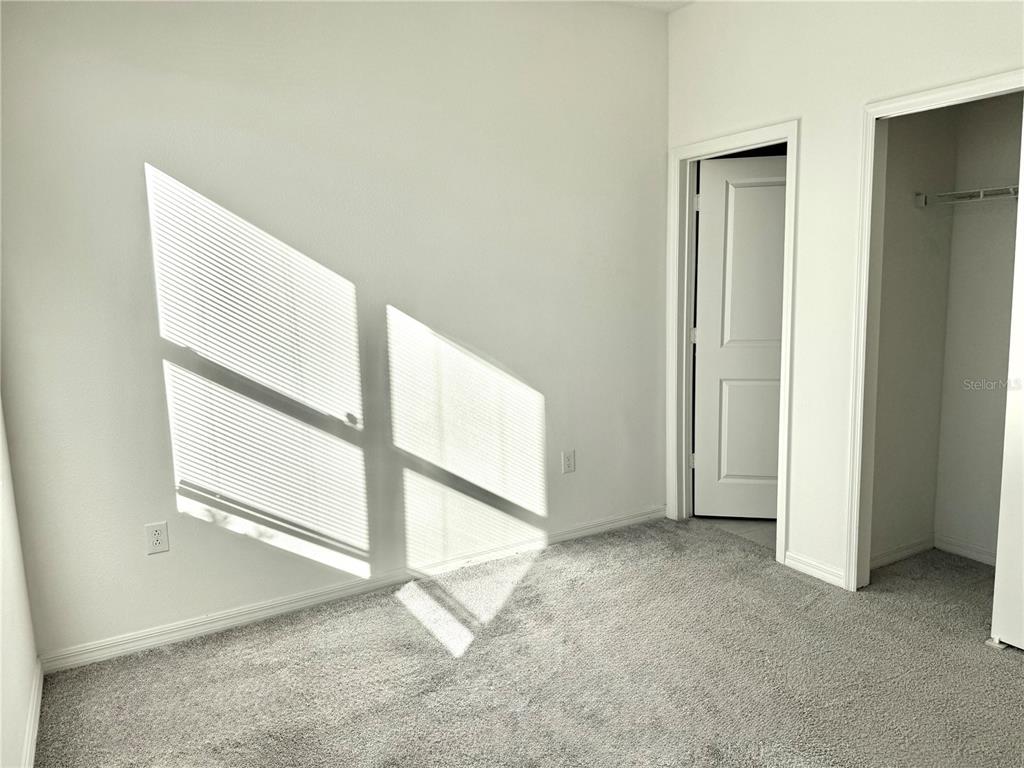 9023 Hooton Way Davenport, FL 33896 - Photo 14 of 25 a view of an empty room