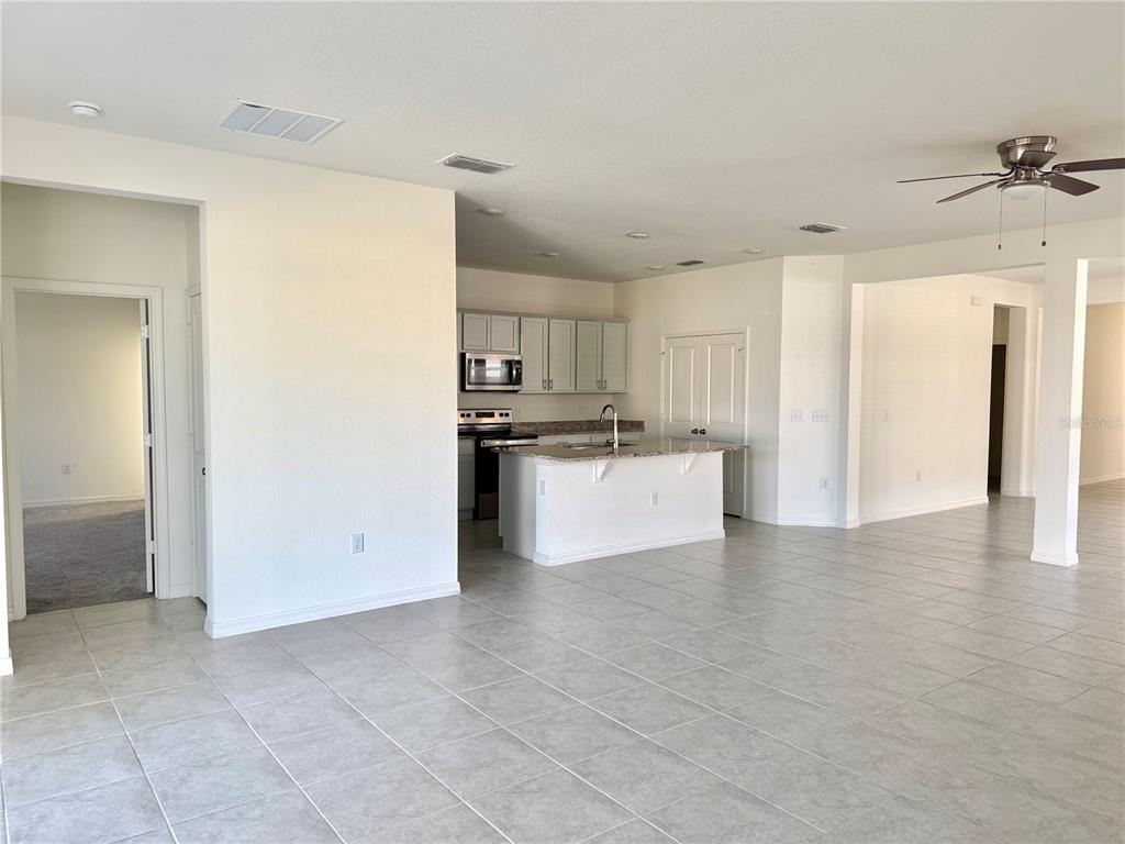 9023 Hooton Way Davenport, FL 33896 - Photo 5 of 25 a view of a kitchen with a sink