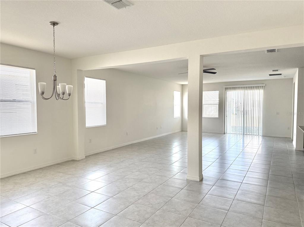 9023 Hooton Way Davenport, FL 33896 - Photo 6 of 25 a view of a livingroom with an empty space and a window