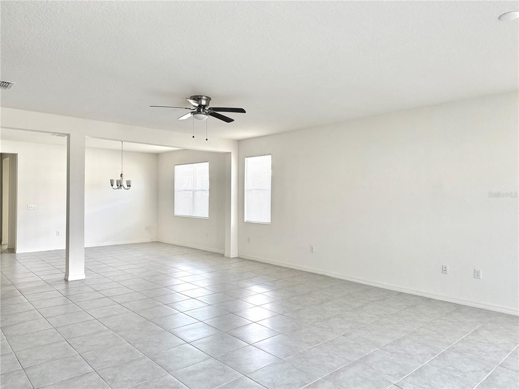 9023 Hooton Way Davenport, FL 33896 - Photo 7 of 25 a view of an empty room with a window