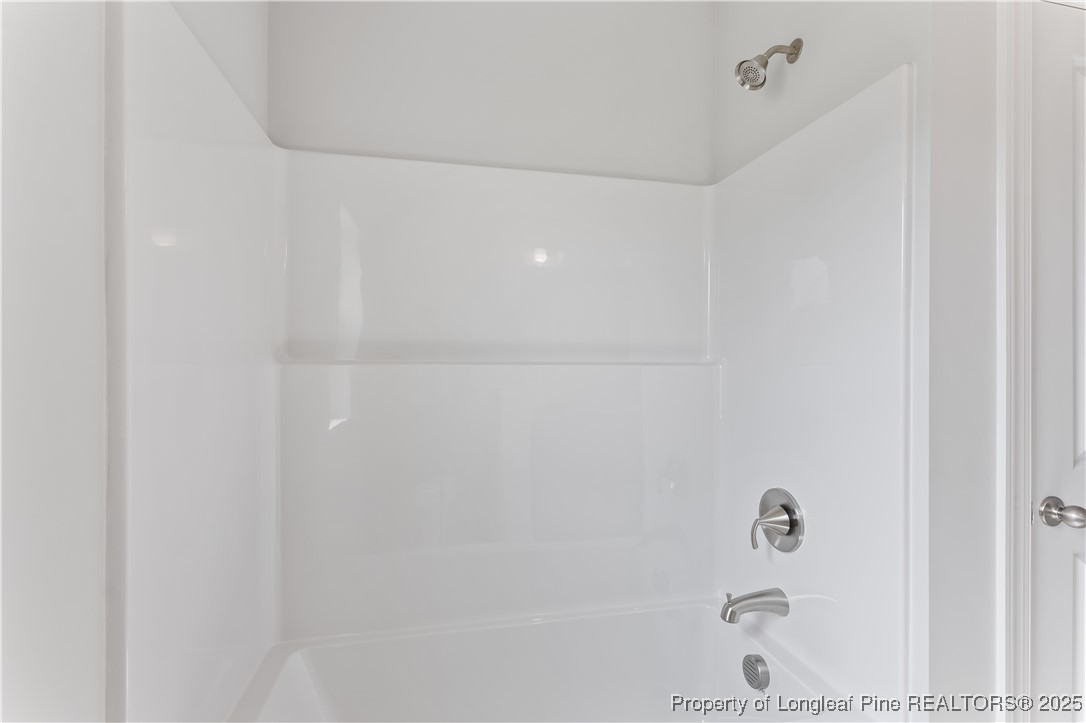 3117 Wolfpack Lane Eastover, NC 28312 - Photo 11 of 45 a bathroom with a bathtub