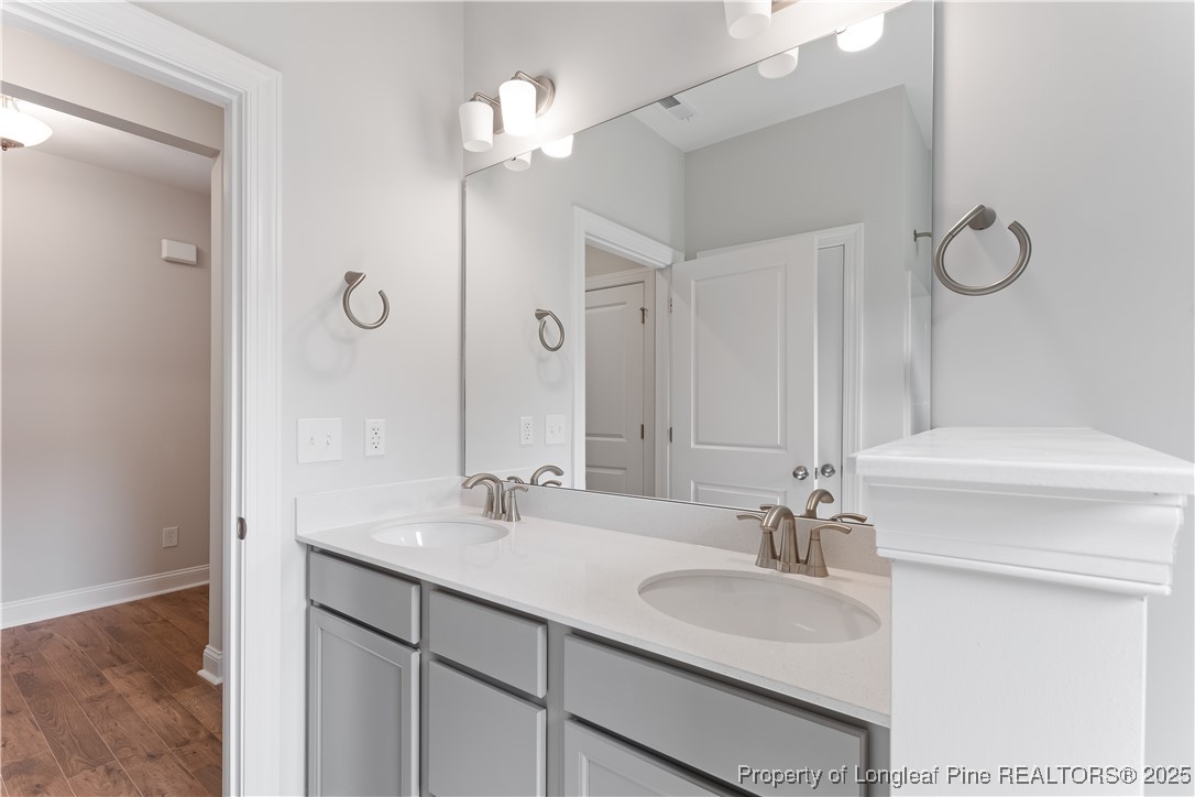 3117 Wolfpack Lane Eastover, NC 28312 - Photo 12 of 45 a bathroom with a sink vanity granite and a mirror